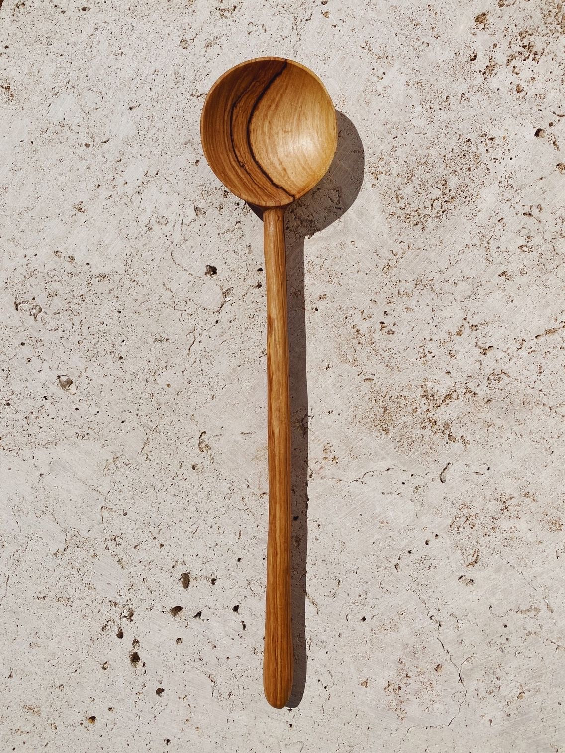 https://thewellrefill.com/cdn/shop/products/artisan-and-adventurers-olive-wood-flat-mixing-spoon-1_1136x.jpg?v=1648142739