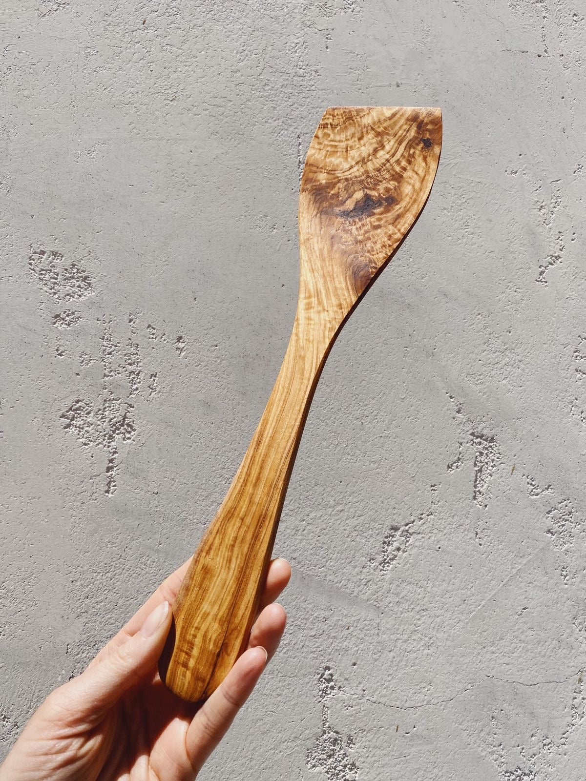 https://thewellrefill.com/cdn/shop/products/redecker-olive-wood-curved-spatula_2048x2048.jpg?v=1655921453